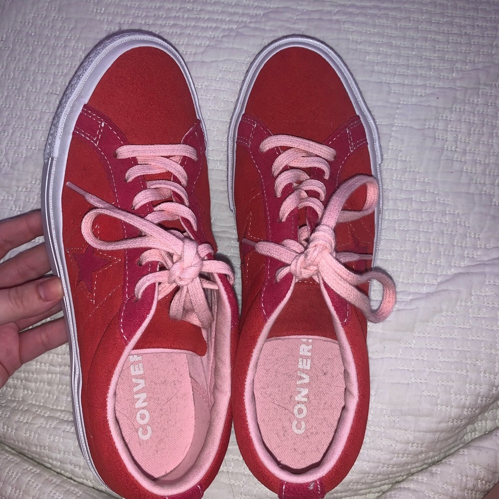 red and pink low top converse